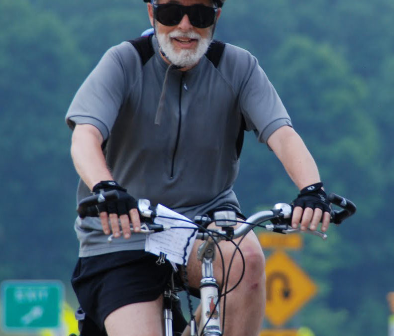 Mark biking on the Mississippi